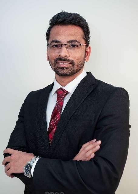 Dr. Subhash Ushakoyala in a dark suit